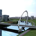 Modern Arch Landscape Bridge Over Water in Urban Area with Skyscrapers and Greenery