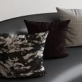Decorative Throw Pillows Featuring Camouflage Brown And Checkered Patterns On Black Sofa 3d model