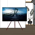 Modern Television on Tripod Stand Showing Movie Oblivion Scene in Bright Room with Potted Plant