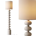 Modern Floor Lamp With Stacked Spherical Base And Beige Lampshade Design