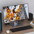 Modern Desktop Computer Setup with Monitor Case Keyboard Mouse and Speakers on Wooden Desk