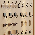 Various Decorative Wall Hooks On Wooden Board With Black Brown And Gold Designs
