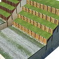 Road Facilities Featuring Multi Layered Colored Barriers And Green Grass Structure