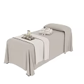 Comfortable Massage Bed With Soft Linen Cover Spa Towel And Essential Oil Bottles