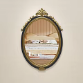 Oval Mirror with Gold and Black Ornate Frame Reflecting Bed and Striped Wall
