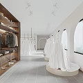 Spacious Bridal Shop Showroom With White Wedding Dresses Hanging Clothes And Display Racks