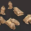 Brown Burlap Sandbags With Knotted Tops In Stacked And Loose Arrangement