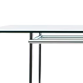 Modern Transparent Glass Table With Sleek Chrome Metal Legs And Minimalist Design