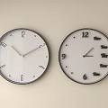 Two Wall Clocks Featuring Arabic Numerals and Time Themed Text on Beige Wall 3d model