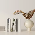 Ornamental Decor Set With Stacked Books And Ceramic Vase With Fern Leaves