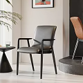 Black And Brown Dining Chairs On Display Platform Near Gray Wall With Colorful Painting