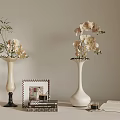 Elegant Tabletop Decor Setup With Vases Flowers Framed Pictures Books And Cup