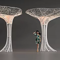 Modern White Tree Shaped Pergola Design With Mesh Canopy Lighted Structure And Woman Standing
