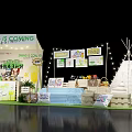 Spring Themed Booth With Teepee Tent String Lights And Decorative Signs 3d model