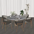 Round Marble Top Dining Table Set With Gray Chairs Wooden Legs And Plant Decor