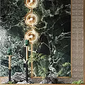 Luxurious Green Marble Feature Wall With Gold Circular Lighting And Green Plants