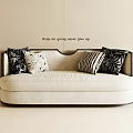 Stylish Beige Double Sofa With Black Frame And Black White Patterned Pillows