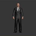 Bald Man in Black Suit and Tie Standing Against Gray Background