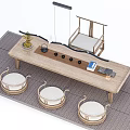 Natural Wood Tea Table with Round Stools and Tea Accessories on Woven Rug