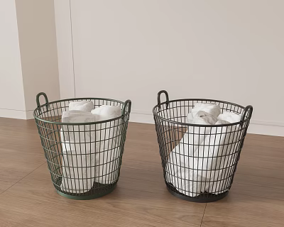 Two Metal Wire Baskets With White Linens On Wooden Floor 3d model