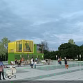 Yellow And Green Container Building With Glass Windows Terrace Outdoor Seating And Leisure Space