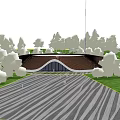 Circular Building With Wavy Brown Roof Surrounded By Green Grass Trees Gray Striped Pavement And People
