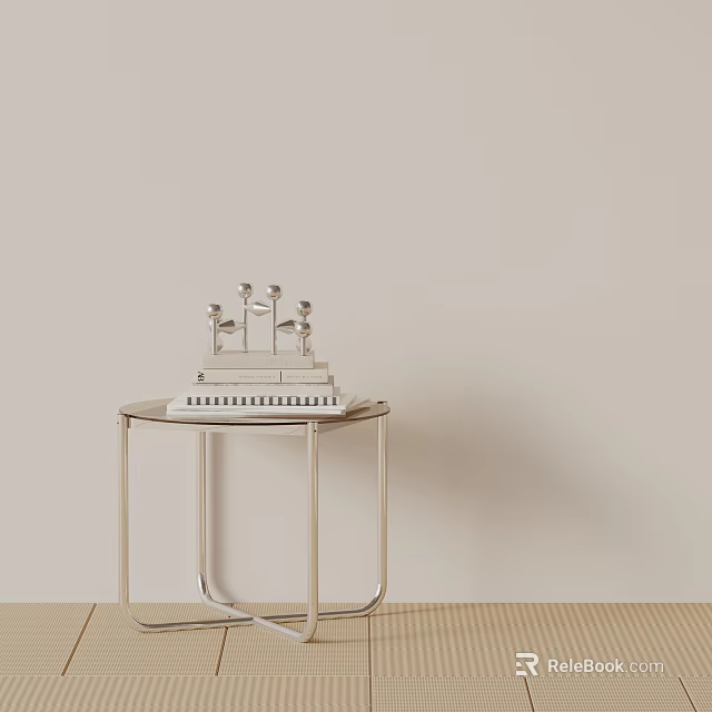 Silver Metal Side Table with Silver Decor and Black White Striped Book Against Light Wall 3d model 
