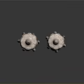 Two Traditional Sculptural Carvings With Ornate Tops Intricate Patterns And Hanging Tassels
