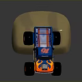 Blue Monster Truck With Flame Graphics And Large Red Tires Jumping Through Dirt Particles