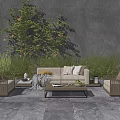 Outdoor Sofa Set With Wicker Chairs Coffee Table And Green Plants Against Gray Wall