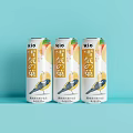 RIO Snowy Fruit Flavored Canned Beverage Three Cans on Light Blue Background