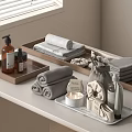 Modern Bathroom Countertop With Neatly Folded Towels And Bath Products On Wooden Trays