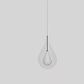 Transparent Glass Teardrop Pendant Light With Illuminated Bulb In Indoor Space