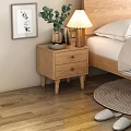 Wooden Bedside Table With Drawers Lamp Plants Books Beside Bed Striped Blanket And Woven Rug