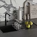 Sleek Black Kitchen Faucet Above Sink On Countertop With Marble Wall Apples And Glass Rack