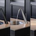 Modern Black Silver and White Faucet with Water Flowing on Kitchen Countertop