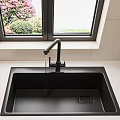 Kitchen Sink Area With Black Sink Faucet White Countertop Window Pink Flowers Green Plants