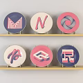 Colorful Circular Logos With Various Letters On Two Wooden Shelves