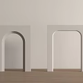 Two White Minimalist Arch Decorations Against Beige Wall With Wooden Floor