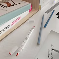 Creative Work Desk with Design Sketches Color Palette Brushes Paints and Hanging Wall Artworks