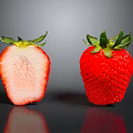 Fresh Whole And Sliced Strawberries With Green Leaves Red Skin And Fleshy Interior