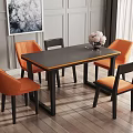 Modern Dining Table Set with Black Tabletop Orange Chairs Vase Flowers and Wall Art in Interior