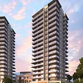 Modern High Rise Residential Buildings With Balconies Under Warm Sunset Sky