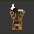 Bamboo Round Side Table With White Conical Vase Brown Mug And Yellow Books