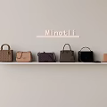 Minot Li Fashionable Bags Displayed On Wall Shelf With Various Colors And Styles