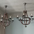 Two Rustic Wooden Chandeliers With Glass Shades And Candle Style Bulbs In Room