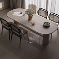 Modern Oval Wooden Dining Table Set with Rattan Back Black Leg Chairs and Vase Flowers