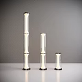 Modern Floor Lamps Set of Three with Varying Heights Transparent Glass Tubes and Sleek Design