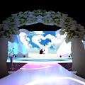 Elegant Banquet Hall Setup With Staged Platform Floral Decorations And Ambient Lighting