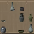 Various Traditional Ceramic Vessels Vases And Bowls Displayed On Wooden Shelf